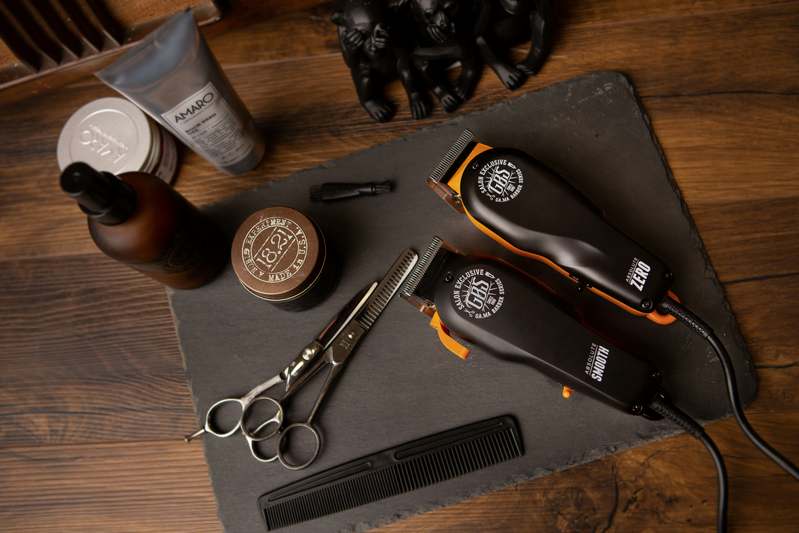 Collection of premium beard scissors arranged neatly on a wood surface